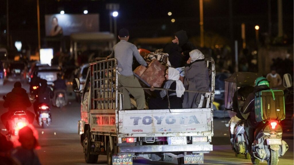 People with belongings ride on a vehicle, after the Israeli army's warning prompted residents to evacuate Beirut's southern suburbs, following an escalation between Hezbollah and Israel amid the U.S.-Israeli conflict with Iran, in Beirut, Lebanon, March 5, 2026. (Reuters/Khalil Ashawi)
