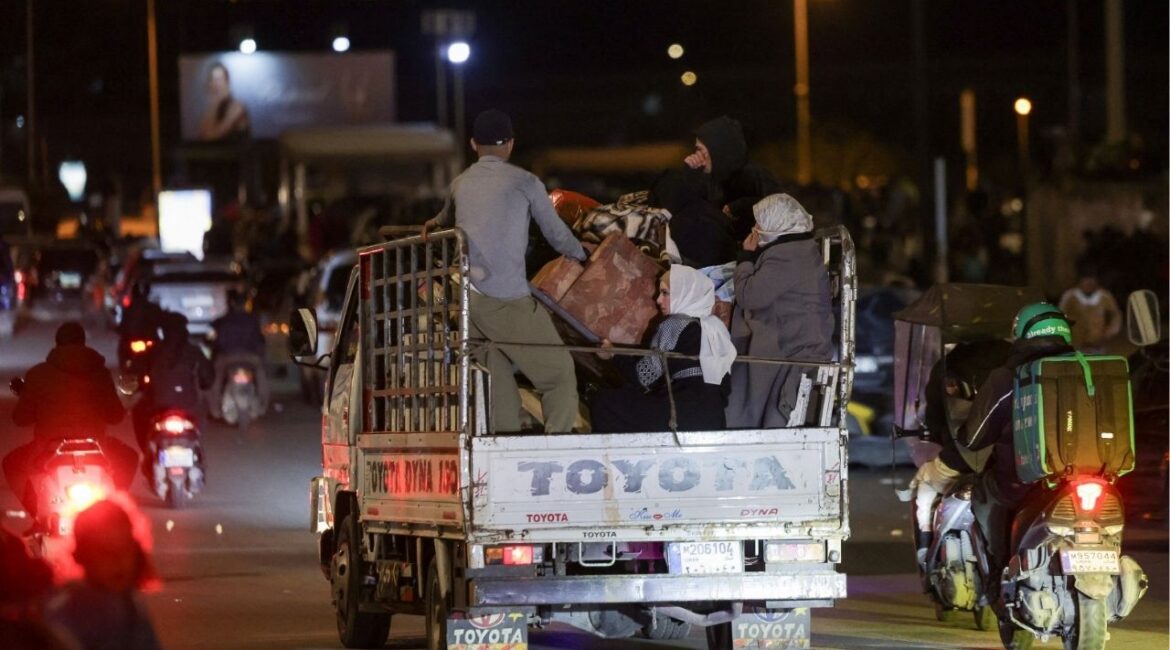 People with belongings ride on a vehicle, after the Israeli army's warning prompted residents to evacuate Beirut's southern suburbs, following an escalation between Hezbollah and Israel amid the U.S.-Israeli conflict with Iran, in Beirut, Lebanon, March 5, 2026. (Reuters/Khalil Ashawi)