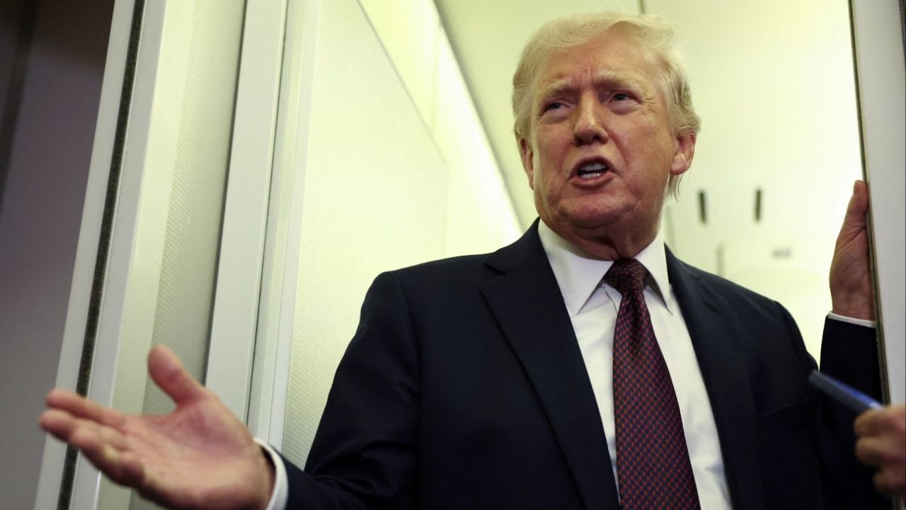 President Donald Trump speaks to reporters aboard Air Force One on a flight back to Washington March 15, 2026. (Reuters/Kevin Lamarque)