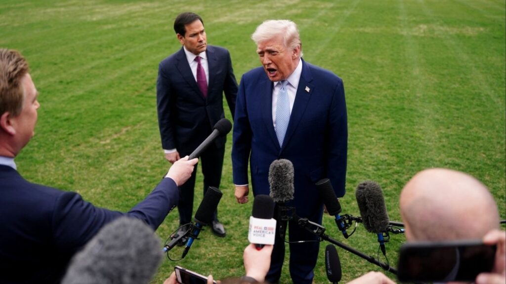 President Donald Trump speaks to the media, flanked by U.S. Secretary of State Marco Rubio, as he departs the White House for Florida, in Washington, D.C., U.S., March 20, 2026. (Reuters/Nathan Howard)