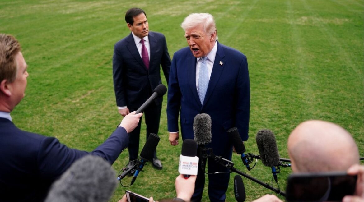 President Donald Trump speaks to the media, flanked by U.S. Secretary of State Marco Rubio, as he departs the White House for Florida, in Washington, D.C., U.S., March 20, 2026. (Reuters/Nathan Howard)