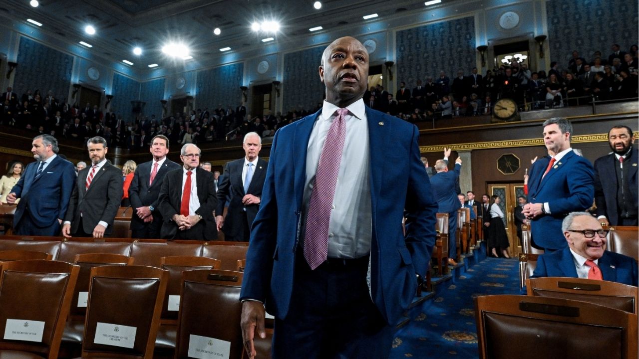 Senator Tim Scott, Republican of South Carolina, stands at the House Chamber before U.S. President Donald J. Trump delivers the first State of the Union address of his second term to a joint session of Congress in the House Chamber of the United States Capitol in Washington, D.C., on Tuesday, February 24, 2026. (Kenny Holston/Pool via Reuters)