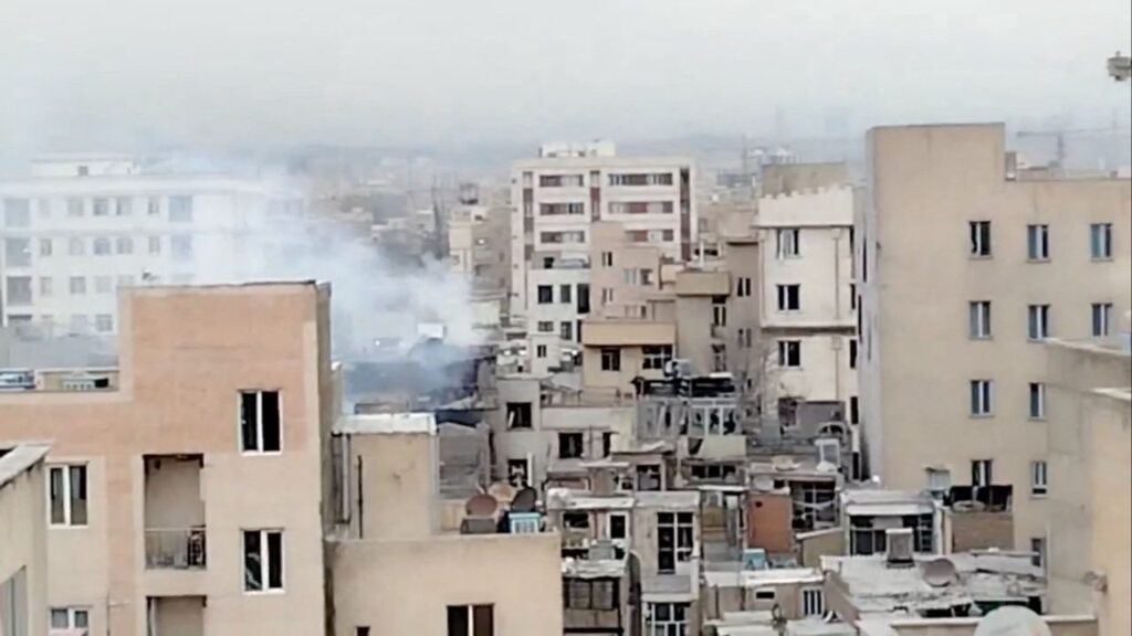 Smoke rises from a building following a reported strike, amid the U.S.-Israeli conflict with Iran, in Tehran, Iran in this screen grab obtained from social media video released March 11, 2026. (Social Media/via Reuters)