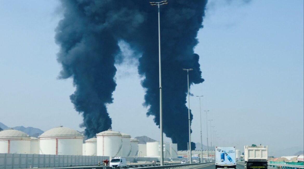 Smoke rises in the Fujairah oil industry zone, caused by debris after interception of a drone by air defenses, according to the Fujairah media office, amid the U.S.-Israel conflict with Iran, in Fujairah, United Arab Emirates, March 14, 2026. REUTERS/Staff