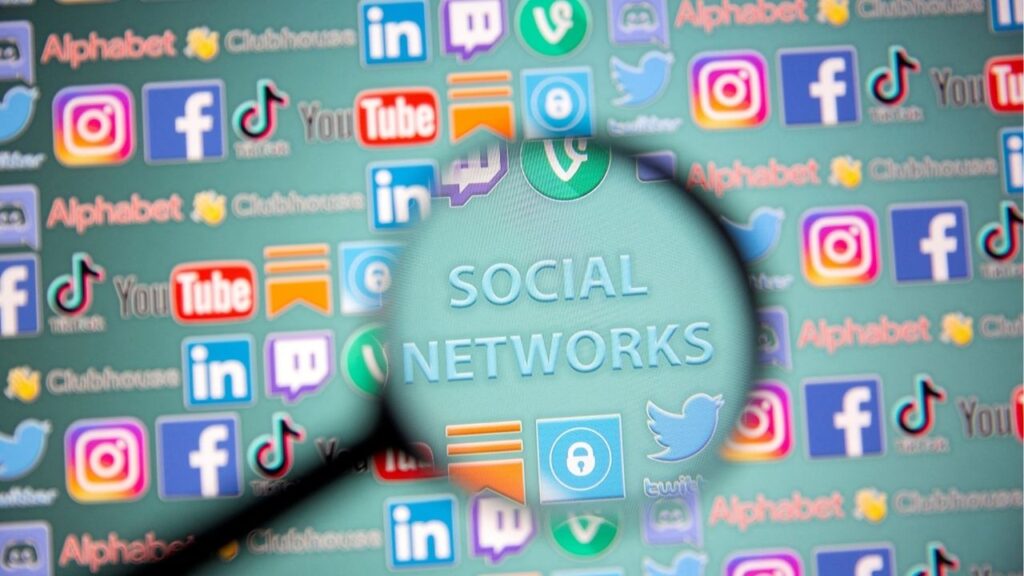 Social network words and social media logos are seen through magnifier displayed in this illustration taken, May 25, 2021. Picture taken May 25, 2021. (Reuters File)
