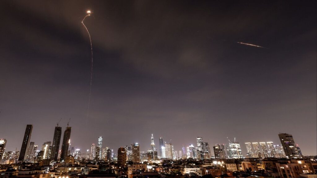 Streaks of light illuminate the sky during an interception attempt amid the U.S.-Israeli conflict with Iran, as seen from Tel Aviv, Israel, March 23, 2026. (Reuters/Amir Cohen)