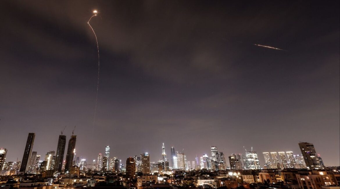 Streaks of light illuminate the sky during an interception attempt amid the U.S.-Israeli conflict with Iran, as seen from Tel Aviv, Israel, March 23, 2026. (Reuters/Amir Cohen)