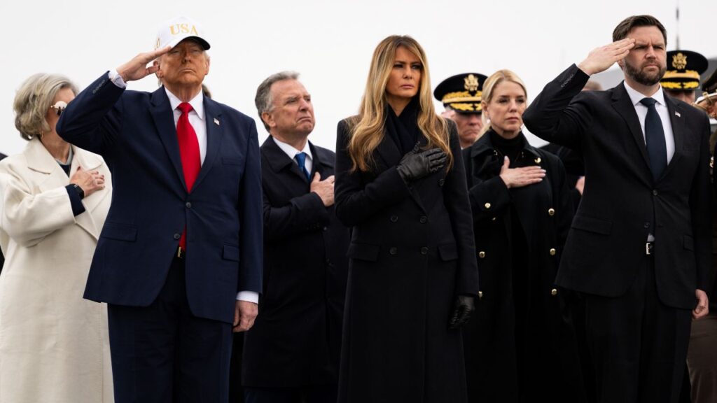 Image of President Trump, Melania Trump and JD Vance saluting as coffins of dead U.S. soldiers are carried off a plane.