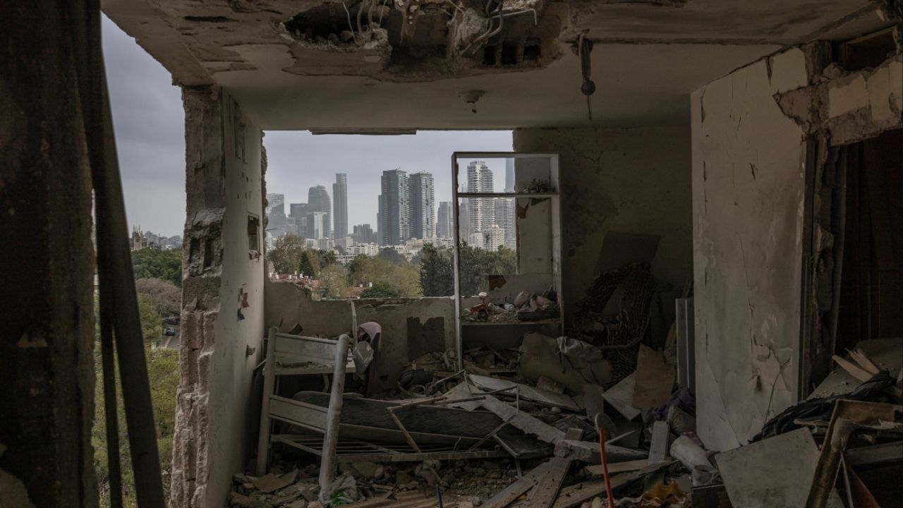 The Tel Aviv skyline is seen from an apartment damaged during an overnight Iranian missile attackl, on Thursday, March 19, 2026. The Trump administration said on Thursday that it was considering new steps as it scrambles to avert a sustained energy crisis set off by the U.S.-Israeli war against Iran. (Avishag Shaar-Yashuv/The New York Times)