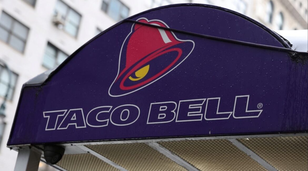 The logo of Taco Bell, a subsidiary of Yum! Brands, Inc. is seen on a store in Manhattan, New York City, U.S., February 7, 2022. (Reuters/Andrew Kelly)