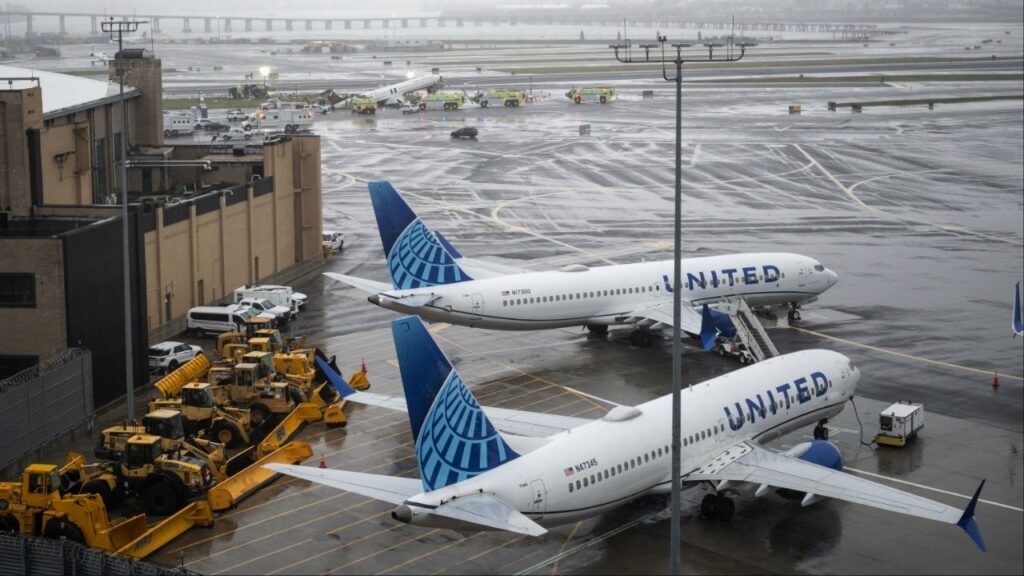 The wreckage of an Air Canada regional jet and a Port Authority fire truck on the runway at LaGuardia Airport in Queens, on Monday, March 23, 2026. A runway collision at New York’s LaGuardia Airport late Sunday killed two people, injured dozens more and shut down one of the busiest domestic airports in the region. (Victor J. BLue/The New York Times)