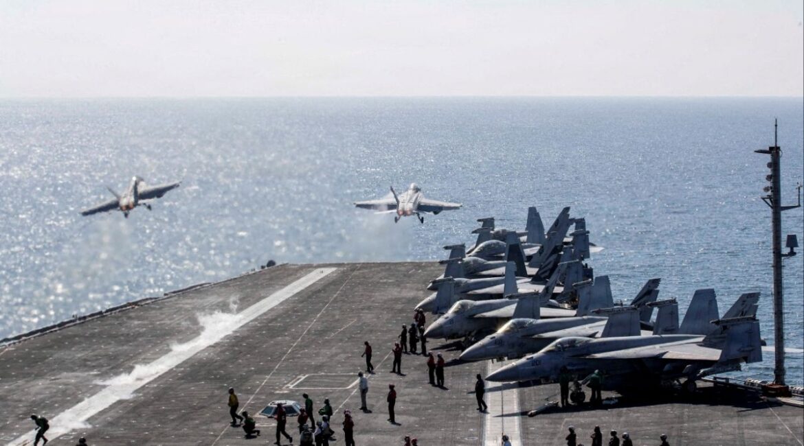 Two F/A-18 Super Hornets launch from the flight deck of the U.S. Navy Nimitz-class aircraft carrier USS Abraham Lincoln in support of the Operation Epic Fury attack on Iran from an undisclosed location March 3, 2026. (Reuters File)