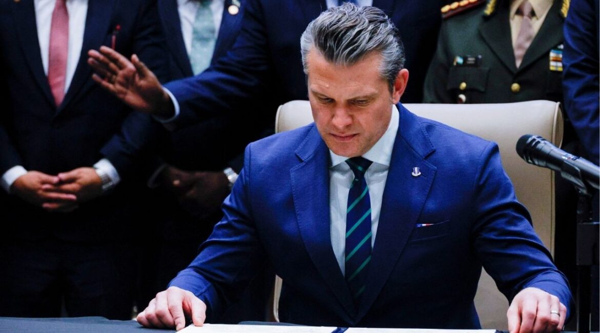 U.S. Secretary of Defense Pete Hegseth looks at the signed joint security agreement at the inaugural Americas Counter Cartel Conference with regional defense and security leaders at U.S. Southern Command headquarters in Doral, Florida, U.S., March 5, 2026. (Reuters File)