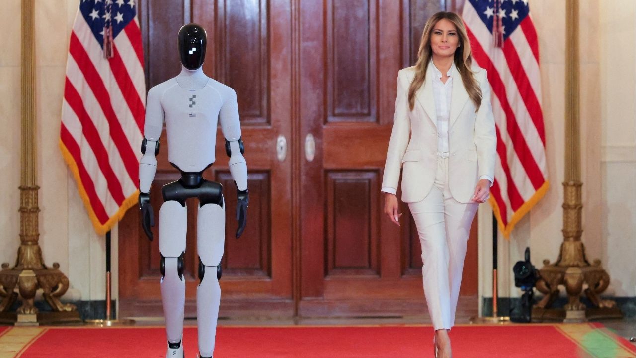 U.S. first lady Melania Trump walks next to a humanoid robot as she hosts a roundtable event on the second day of the inaugural Fostering the Future Together Global Coalition Summit, at the White House in Washington, D.C., U.S., March 25, 2026. (Reuters/Kylie Cooper)