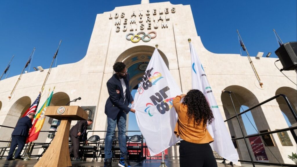 Workers from LA28 setup Olympic and Paralympic flags outside the Los Angeles Coliseum in Los Angeles, California, U.S., May 8, 2025. (Reuters File)