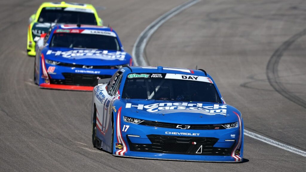 Corey Day leads Kyle Larson early in the final stage of the O'Reilly Series NASCAR race at Las Vegas Motor Speedway.