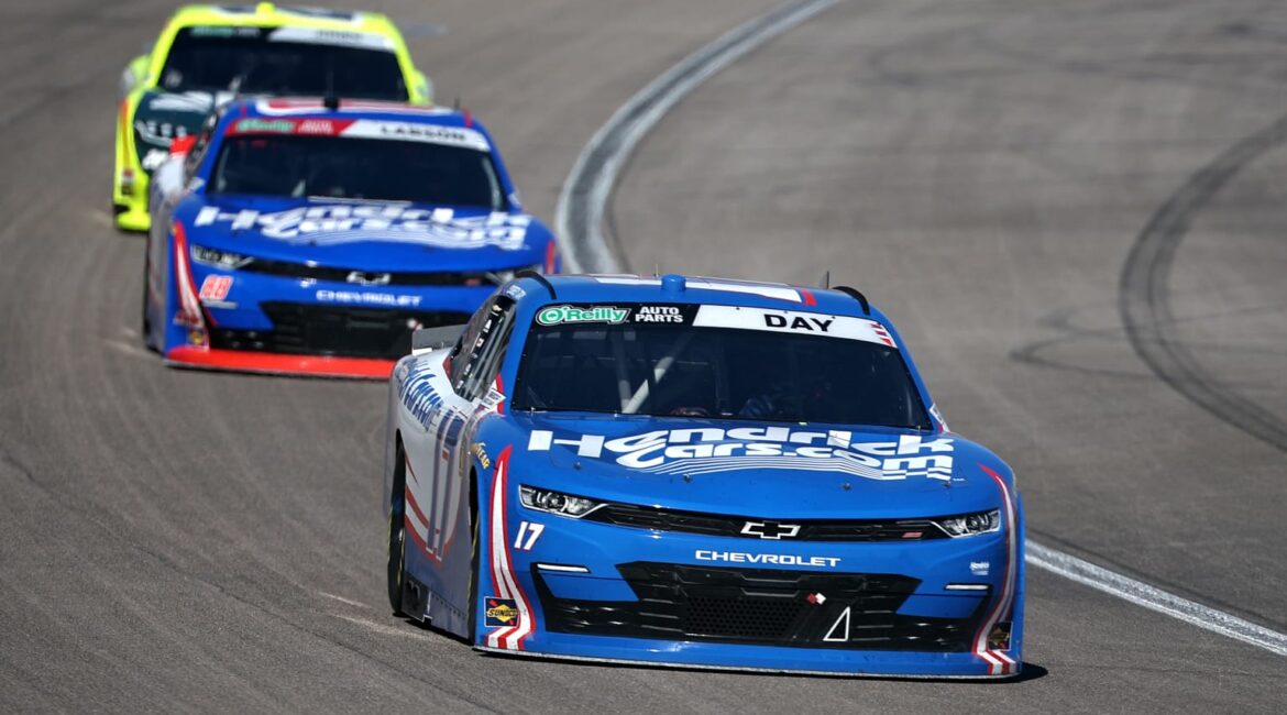 Corey Day leads Kyle Larson early in the final stage of the O'Reilly Series NASCAR race at Las Vegas Motor Speedway.