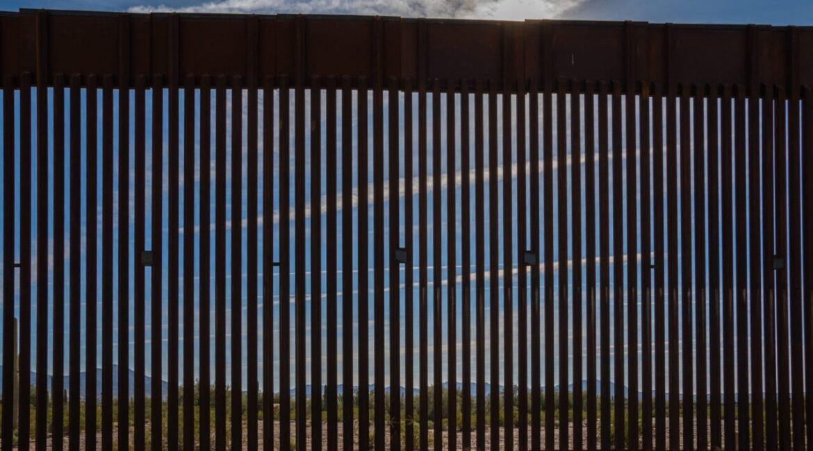 Image of a border wall between the U.S. and Arizona