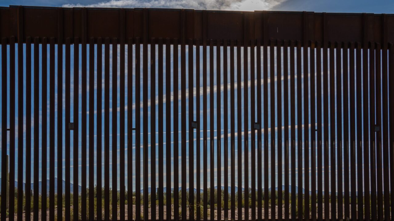 Image of a border wall between the U.S. and Arizona