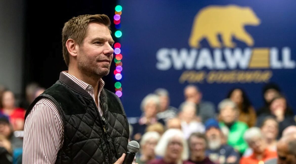 Image of U.S. Rep. Eric Swalwell in an open collar shirt and quilted sportsman's vest