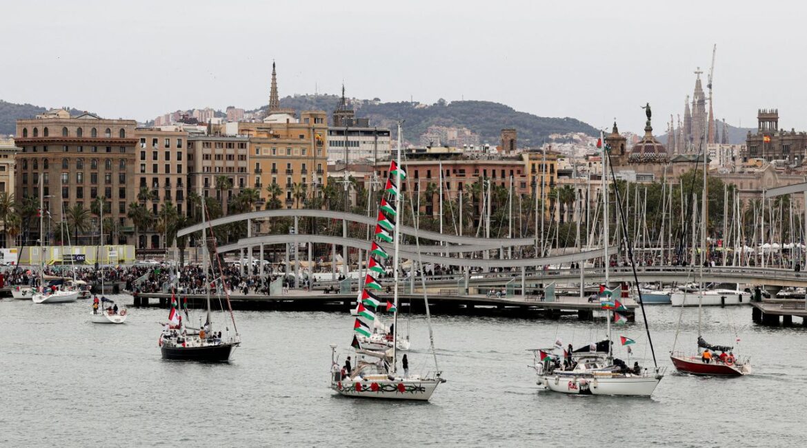 Image of sailboats exiting the harbor of Barcelona Spain