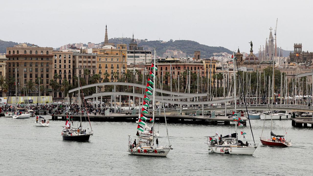 Image of sailboats exiting the harbor of Barcelona Spain