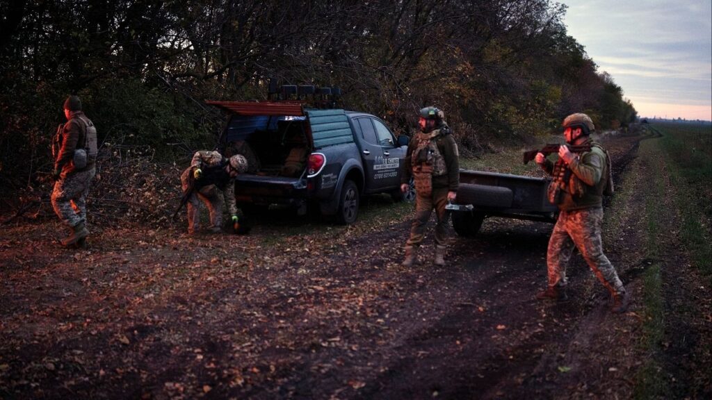 A Ukrainian artillery unit enters a tree line in the Dnipropetrovsk region of Ukraine, Oct. 17, 2025. Tree lines originally planted to shield crops from wind are now used by troops to seek cover. (Tyler Hicks/The New York Times)
