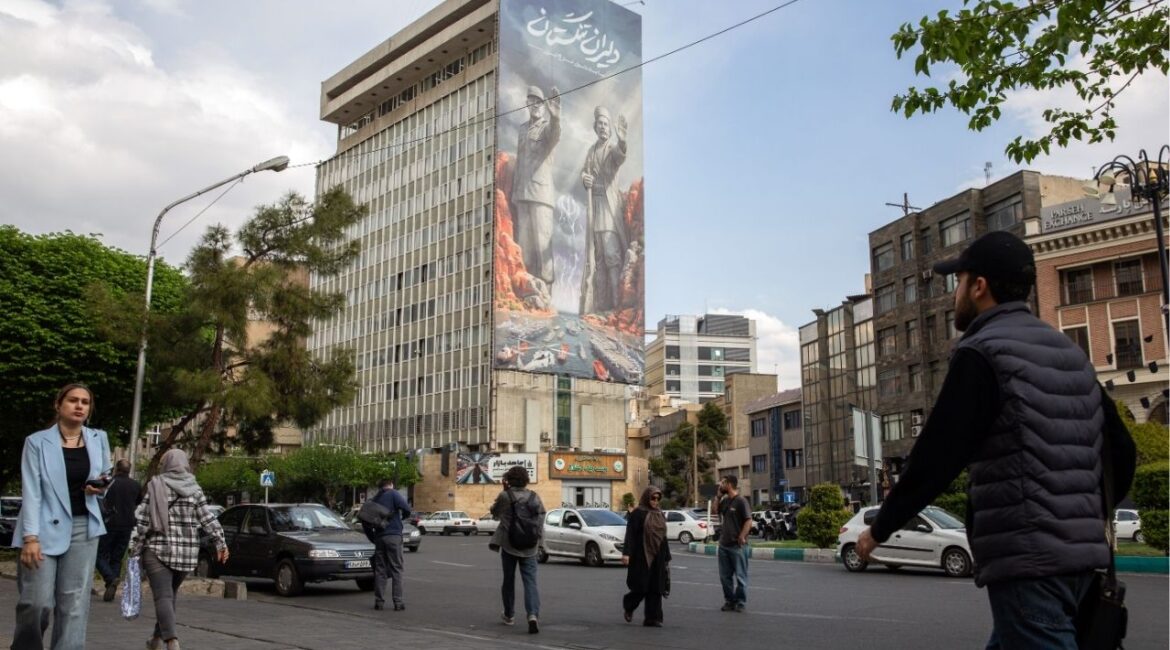 A billboard in Tehran, Iran, on Monday, April 13, 2026, depicts Alireza Tangsiri, the late commander of Iran’s Revolutionary Guards naval force, and a historical hero as they stand on both sides of the Strait of Hormuz. Oil markets shrugged it off, but the effort to hurt Iran could provoke retaliation that inflicts more damage on energy assets and the global economy. (Arash Khamooshi/The New York Times)