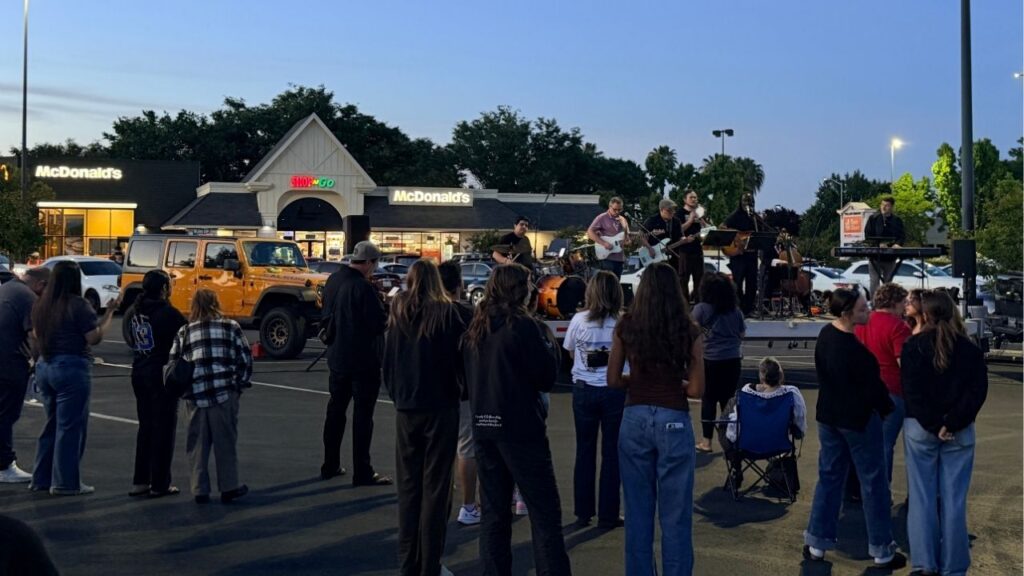 A crowd of people attend the one-year anniversary of Caleb Quick's murder at the McDonald's where he was killed on April 23, 2026. (GV Wire/Anthony W. Haddad)
