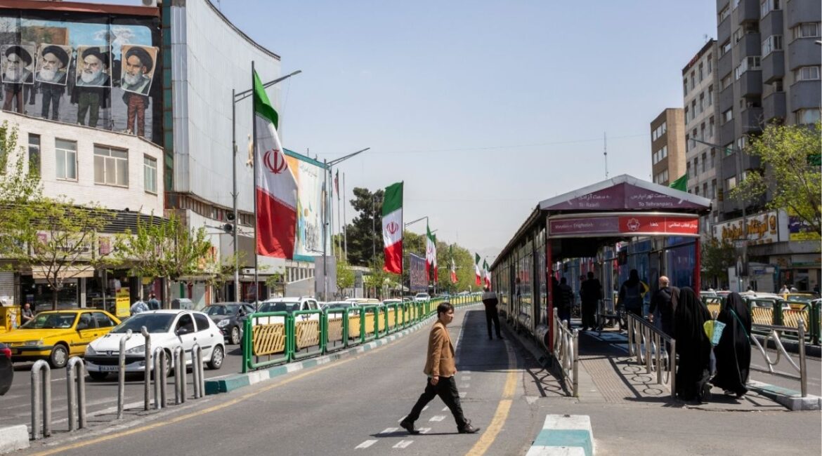 A man crosses Enghelab Street near a bus stop in Tehran, April 5, 2026. Iran on Wednesday, April 15, threatened further retaliation over an American naval blockade of its ports in the critical Strait of Hormuz as the U.S. military said that it had “completely halted” trade in and out of Iran by sea. (Arash Khamooshi/The New York Times)
