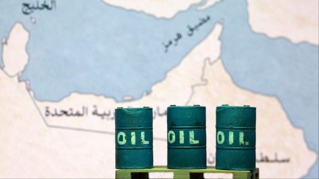 A map showing the Strait of Hormuz, also known as Madiq Hurmuz, and 3D printed oil barrels are seen in this illustration taken March 26, 2026. REUTERS/Dado Ruvic/Illustration