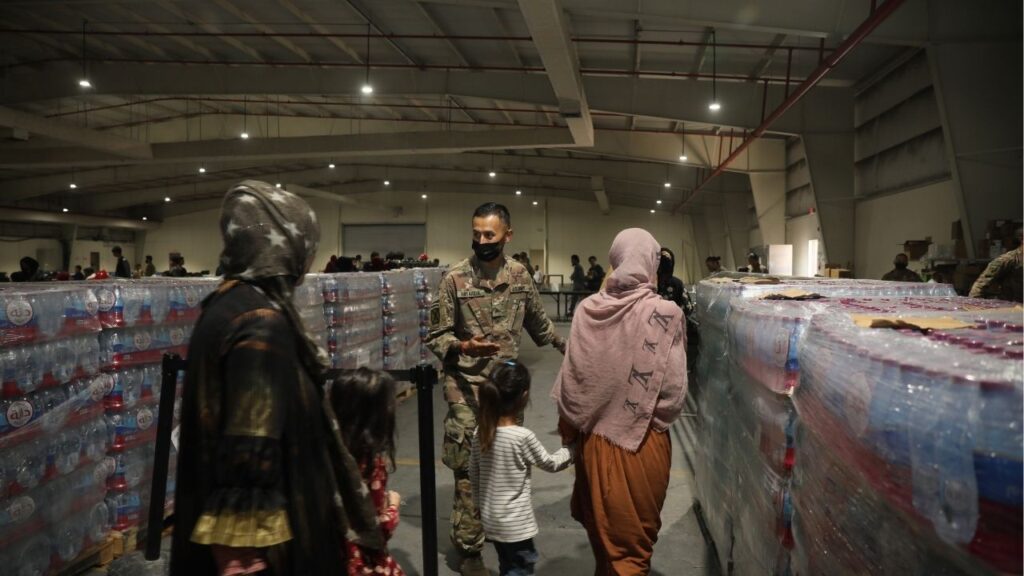 A photo provided by Sgt. Jimmie Baker/U.S. Army shows Afghans at Camp As Sayliyah, in Qatar, in August 20, 2021. Once promised a move to the United States, Afghan refugees who helped U.S. forces say they face ‘bad or worse’ options: resettlement to Congo or returning home to live under the Taliban. (Sgt. Jimmie Baker/U.S. Army via The New York Times)