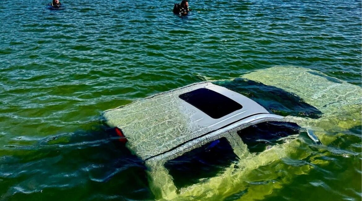 A pickup truck and empty jet ski trailer slid into Bass Lake at a boat ramp during a sheriff’s dive team training, but were later recovered without injuries or environmental damage. (Madera County SO)