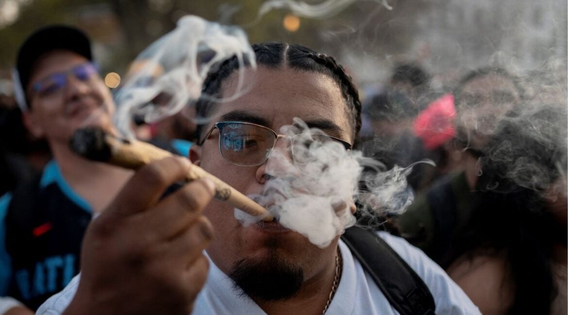 A reveller smokes cannabis at the Mile High 420 Festival in Denver, Colorado, U.S., April 20, 2026. (Reuters/Cheney Orr)