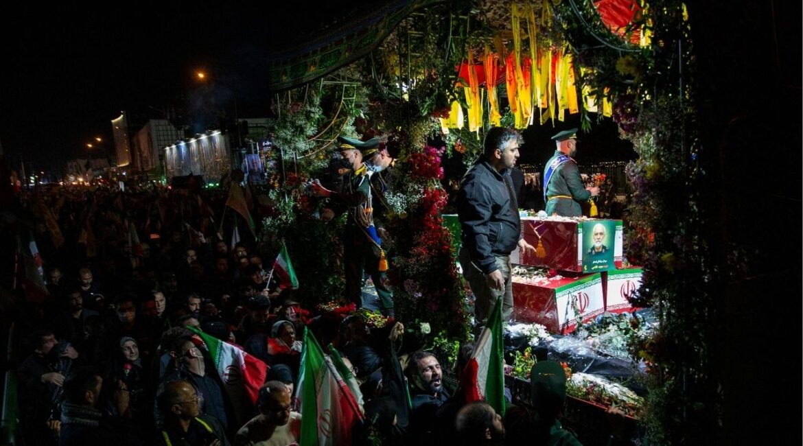 A truck carries the coffin of Major Gen. Majid Khademi, head of intelligence for Iran's paramilitary Revolutionary Guard, during his funeral procession in Tehran, Iran, April 8, 2026. (Arash Khamooshi/The New York Times)