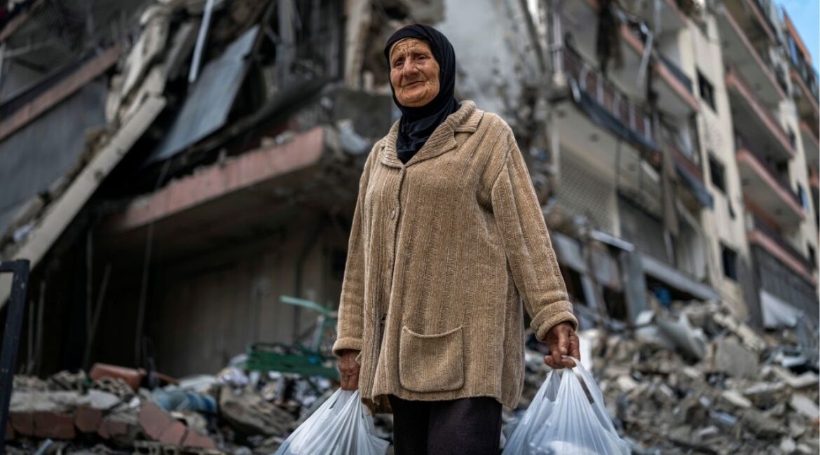 A woman displaced by the fighting near her home in Marjayoun, Lebanon, carries belongings in plastic bags in Dahiyeh, a suburb south of Beirut, on Friday, April 17, 2026. A 10-day ceasefire between Israel and Lebanon went into effect on Friday, potentially removing a major stumbling block in the ongoing peace talks between the United States and Iran. (Diego Ibarra Sanchez/The New York Times)