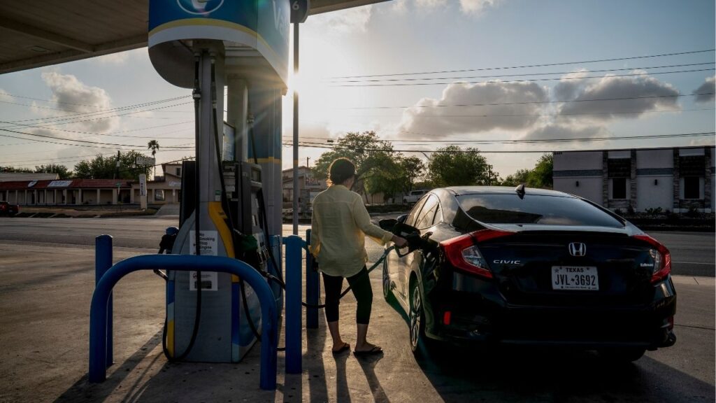 A woman pumps gas in Harlingen, Texas, March 28, 2026. The energy industry refers to the behavior of gasoline prices as “up like a rocket, down like a feather.” (Gabriel V. Cárdenas/The New York Times)