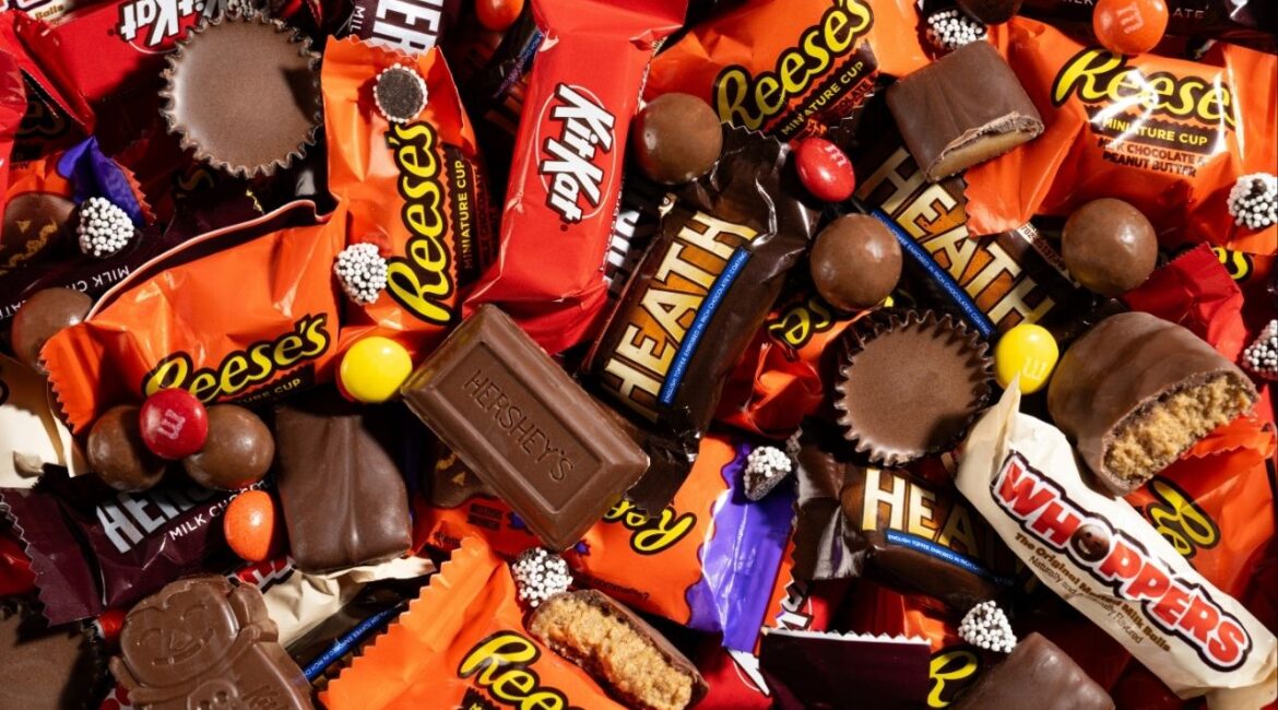 An assortment of Hershey’s candies, including Reese’s, is displayed in Chicago, Oct. 23, 2025. The Hershey Company said it would return to using “classic milk and dark chocolate recipes” in all of its products by 2027, adding that it was responding to consumer preferences. (Morgan Ione Yeager/The New York Times)
