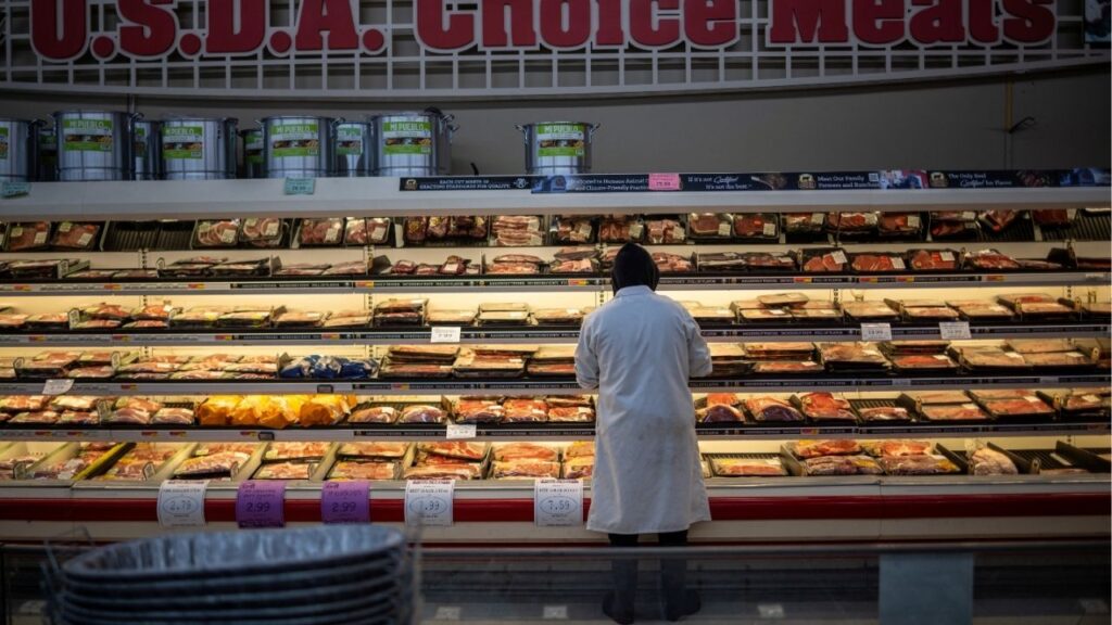 An employee stands at the meat section of a local supermarket located near a Tyson Foods meatpacking plant (not pictured), which is scheduled to shut down in the coming days, in Lexington, Nebraska, U.S. January 14, 2026. (Reuters File)