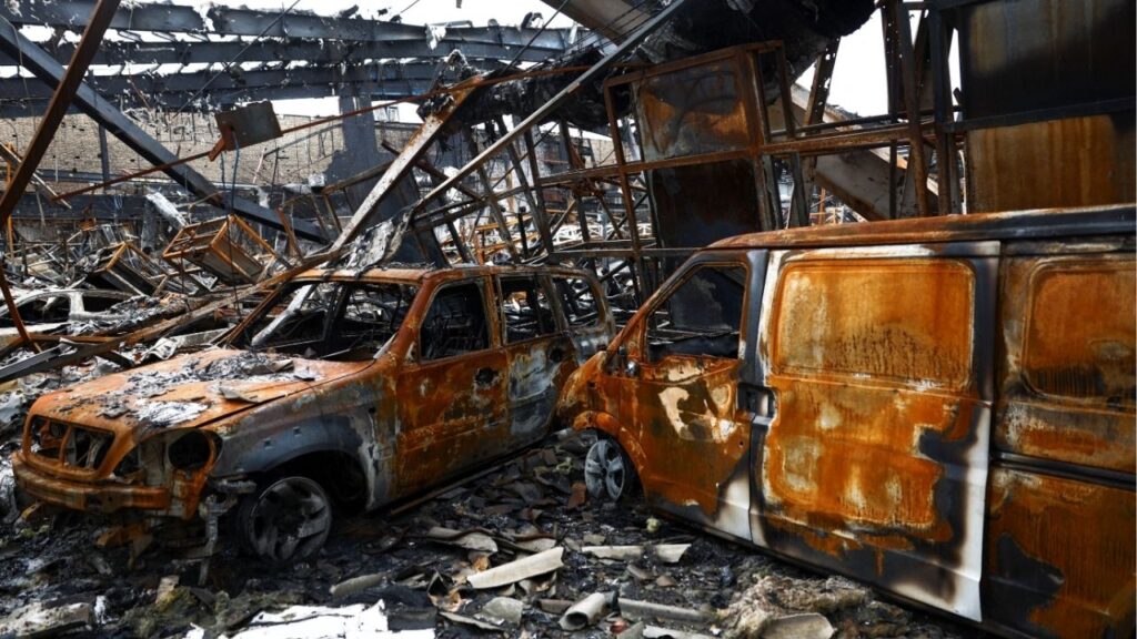 Burnt-out vehicles at the site of a car repair shop and dealership damaged by a strike, amid the U.S.-Israeli conflict with Iran, in Tehran, Iran, March 28, 2026. (Majid Asgaripour/WANA (West Asia News Agency) via Reuters)