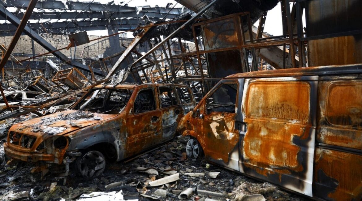 Burnt-out vehicles at the site of a car repair shop and dealership damaged by a strike, amid the U.S.-Israeli conflict with Iran, in Tehran, Iran, March 28, 2026. (Majid Asgaripour/WANA (West Asia News Agency) via Reuters)