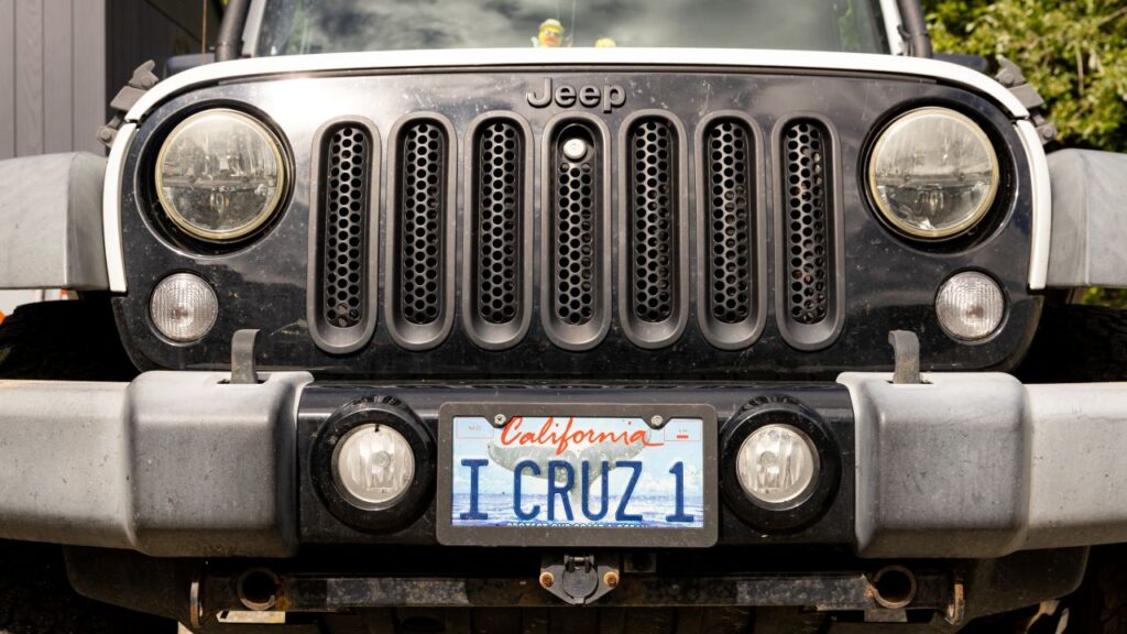 Image of a silver gray Jeep with a I CRUZ 1 personalized California license plate