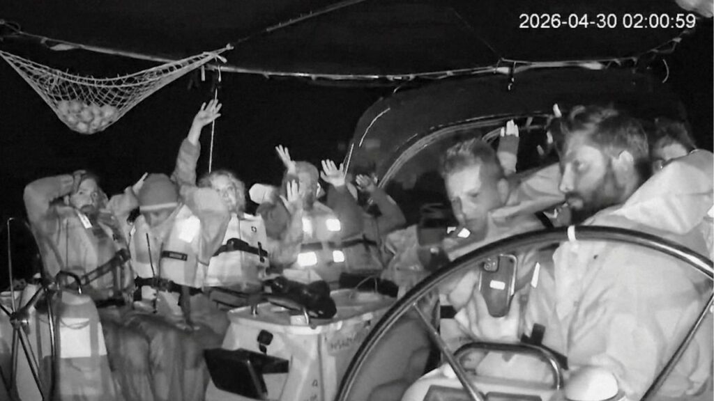 CCTV footage shows crew members of the second flotilla that sailed from the Spanish port of Barcelona, carrying humanitarian aid to Palestinians in Gaza, raise their arms as the vessel is said to be intercepted by the Israeli Army, at a location given as at sea off the coast of Greece, April 30, 2026, in this screengrab taken from a handout video. Global Sumud Flotilla/Handout via REUTERS