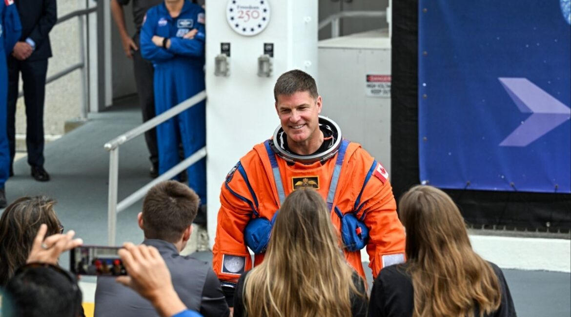 Canadian Space Agency astronaut Jeremy Hansen speaks with family members before he and the rest of the Artemis II crew board a van for the drive to the launchpad at the Kennedy Space Center in Florida on Wednesday, April 1, 2026. The crew of four — three Americans and one Canadian — are scheduled to launch Wednesday evening on the first crewed journey to the moon since 1972. (Kenny Holston/The New York Times)