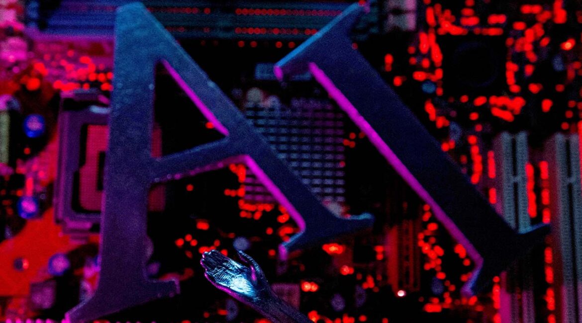 AI (Artificial Intelligence) letters and robot hand are placed on computer motherboard in this illustration created on June 23, 2023. (Reuters/File Photo)