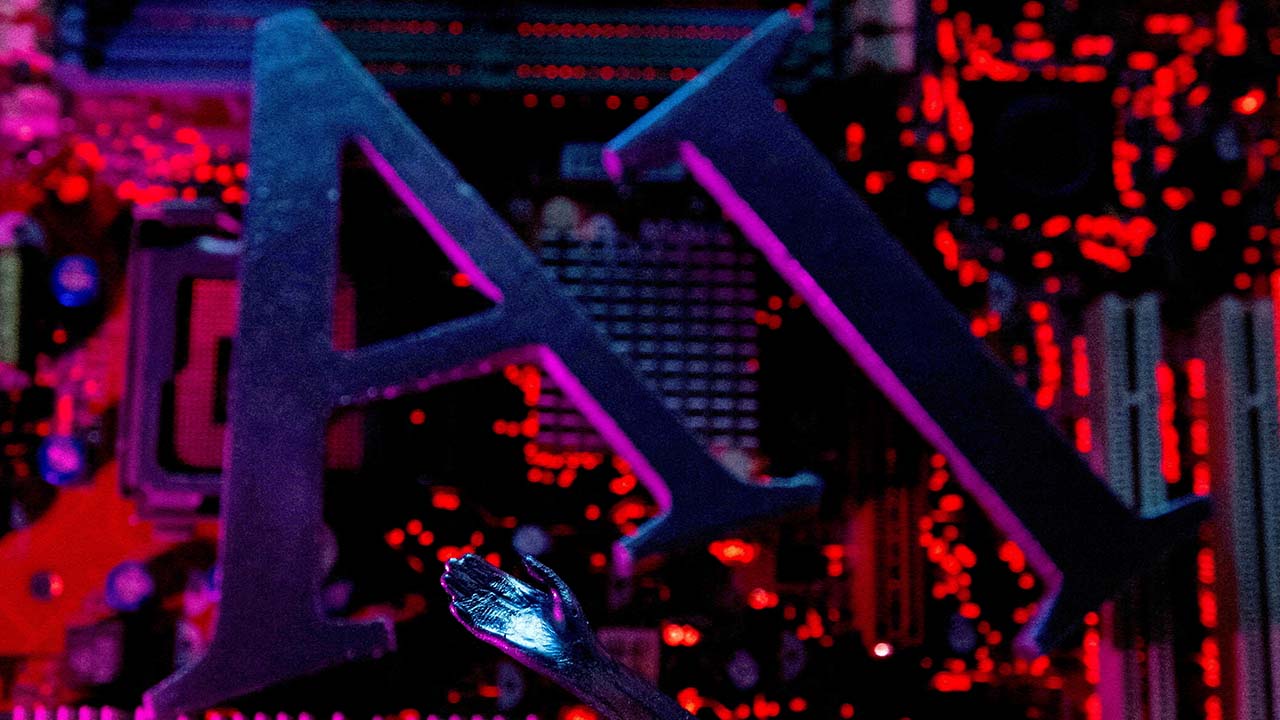 AI (Artificial Intelligence) letters and robot hand are placed on computer motherboard in this illustration created on June 23, 2023. (Reuters/File Photo)