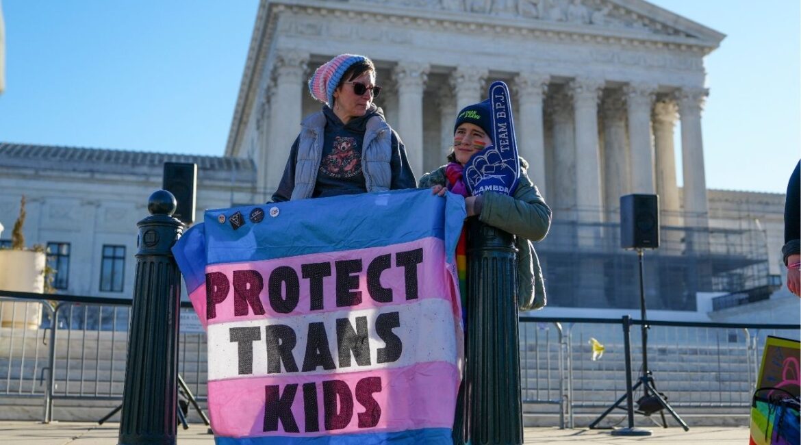 Demonstrators gather outside the U.S. Supreme Court as the court hears arguments concerning transgender athletes participating in girls' sports in Washington, Jan. 13, 2026. The Trump administration has opened an investigation into the sex discrimination policies of the Los Angeles public school district, scrutinizing a measure that gives schools discretion in deciding whether to disclose students’ gender identities to their parents. (Tierney L. Cross/The New York Times)