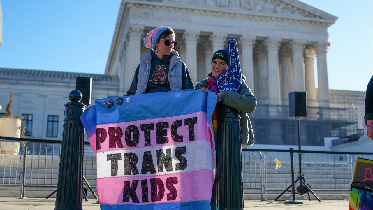 Demonstrators gather outside the U.S. Supreme Court as the court hears arguments concerning transgender athletes participating in girls' sports in Washington, Jan. 13, 2026. The Trump administration has opened an investigation into the sex discrimination policies of the Los Angeles public school district, scrutinizing a measure that gives schools discretion in deciding whether to disclose students’ gender identities to their parents. (Tierney L. Cross/The New York Times)