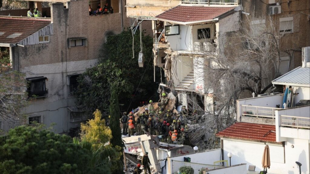 Emergency personnel work at the site of a projectile impact, as the U.S.-Israel conflict with Iran continues, in Haifa, Israel, April 6, 2026. (Reuters/Shir Torem)