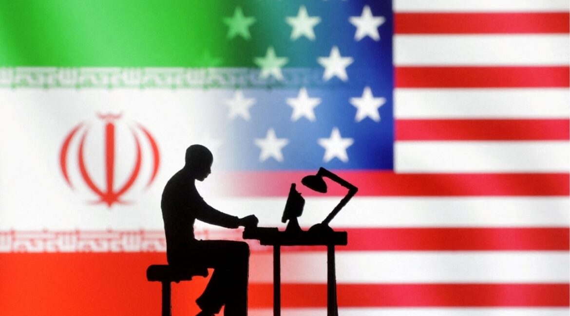 Figurines with computers are seen in front of USA and Iran flags in this illustration created on September 10, 2022. (Reuters File)